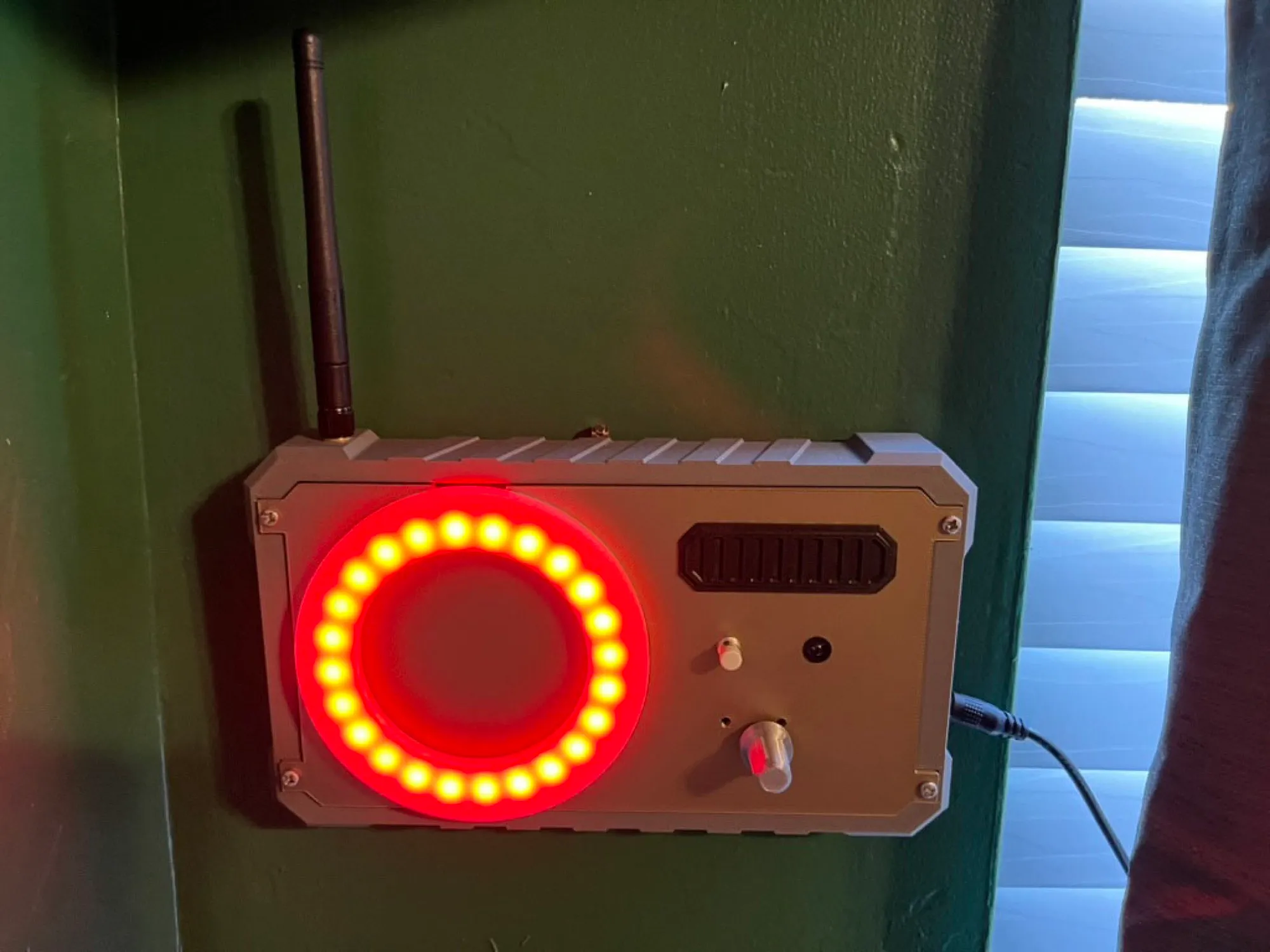 A beacon lamp lit red on the wall
