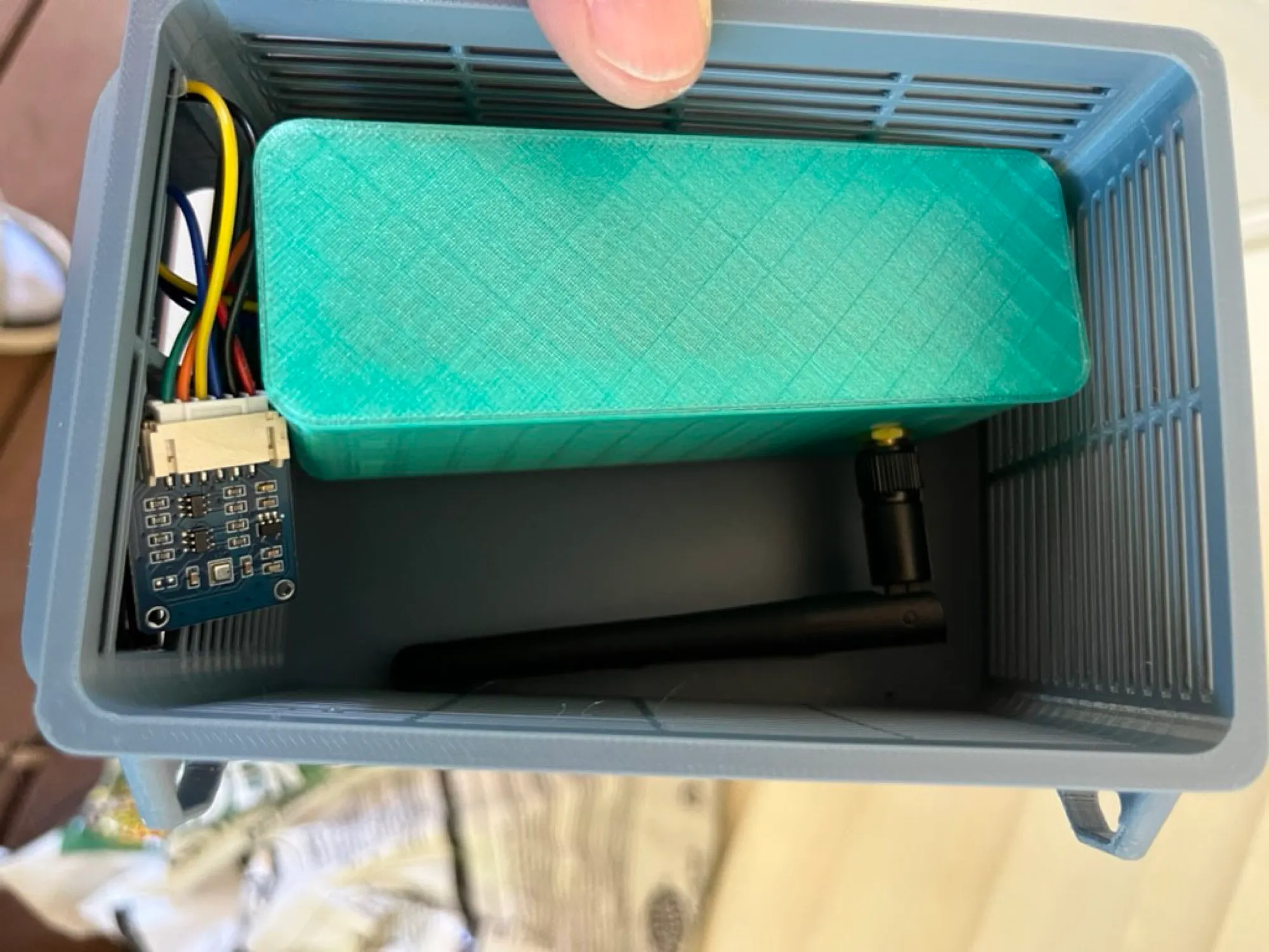 The XIAO ESP32S3 encased and the BME280 breakout inside the open enclosure